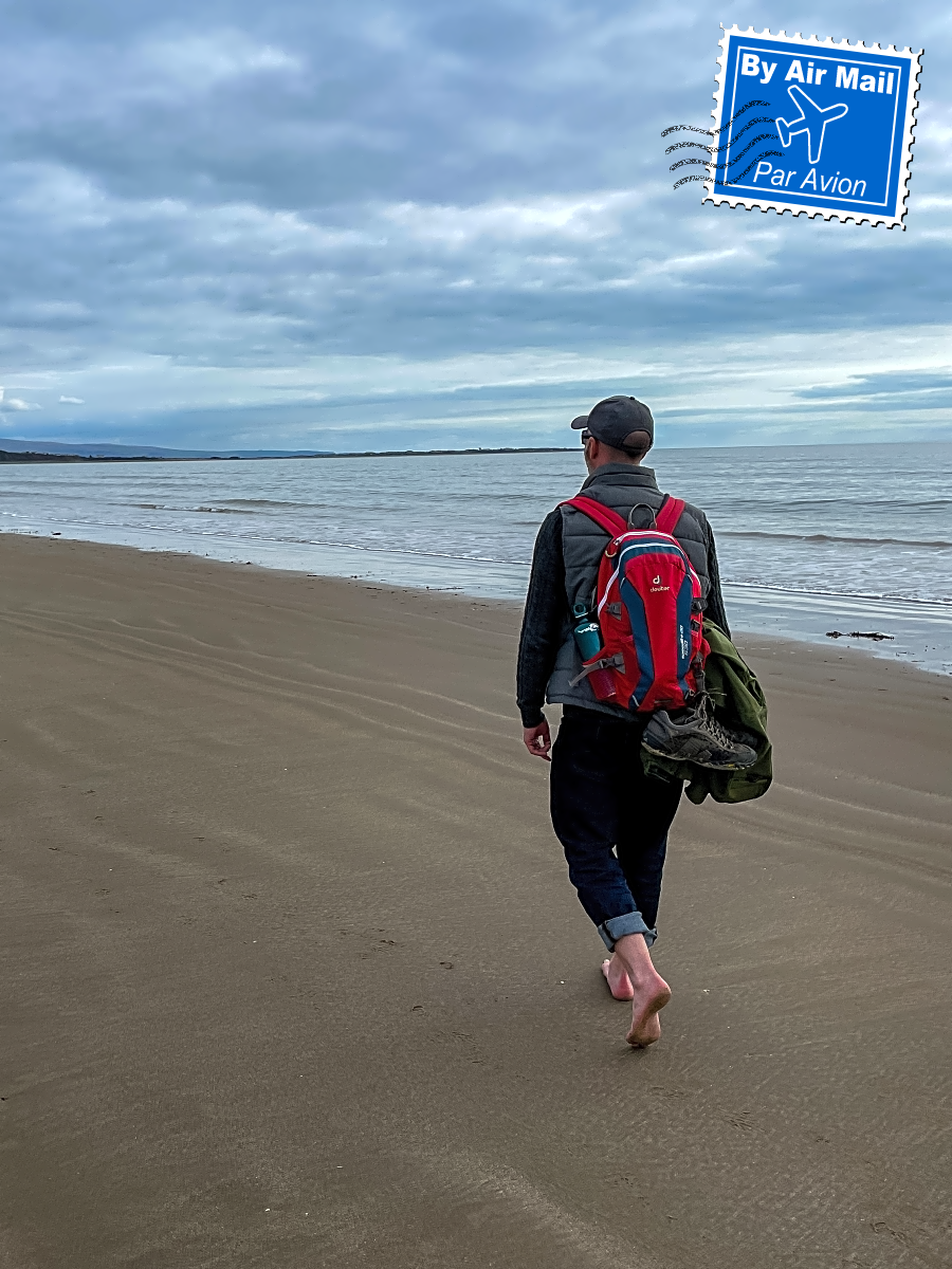 A walk by the sea, with an airmail stamp.